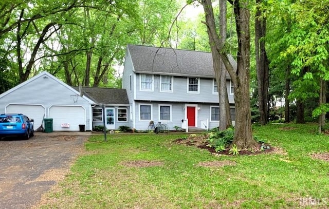 609 Secretariat Cir, Kokomo, IN 46901 - colonial inspired home featuring an attached garage, a front lawn, and driveway
