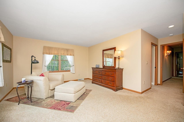 living area with carpet flooring, visible vents, and baseboards