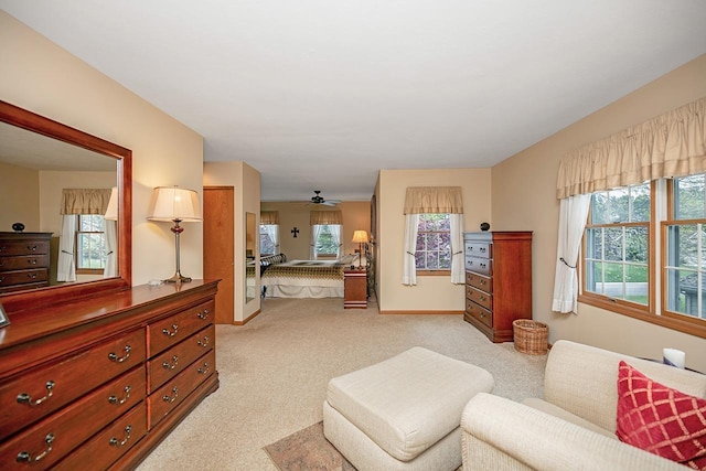 interior space featuring baseboards and light carpet