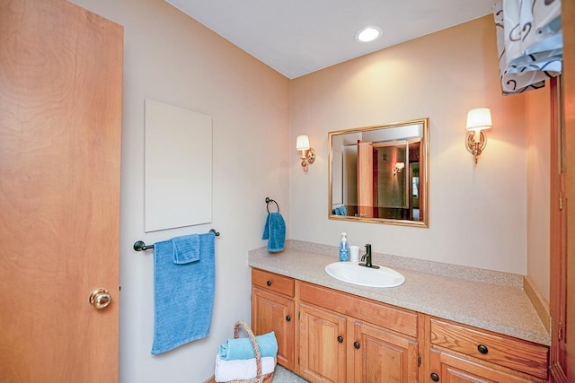 bathroom featuring vanity and recessed lighting