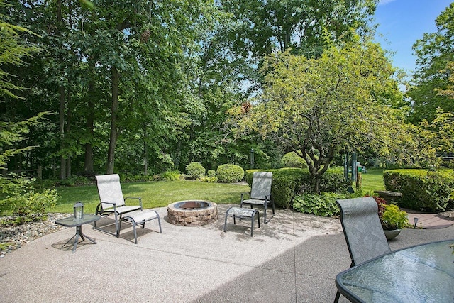 view of patio / terrace featuring an outdoor fire pit