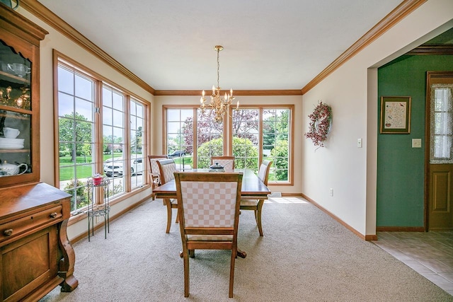 dining room with baseboards, a wealth of natural light, a chandelier, and light colored carpet