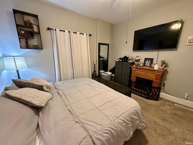 bedroom with carpet flooring and baseboards