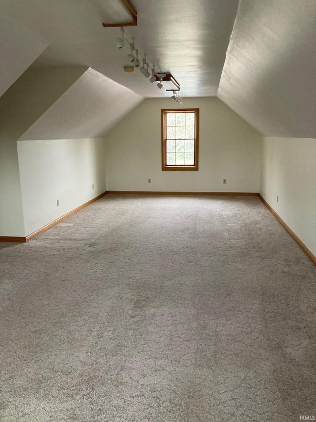 7020 N 20 W, Howe, IN 46746 - additional living space featuring baseboards, carpet floors, and vaulted ceiling