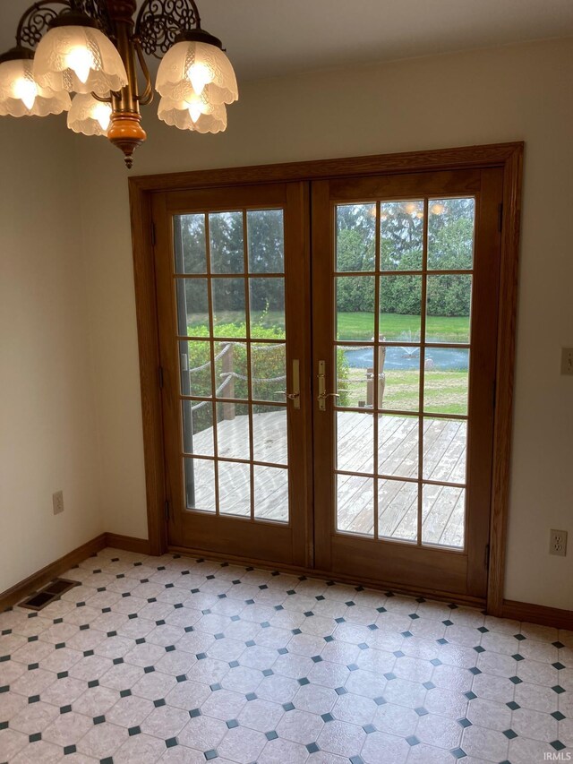 7020 N 20 W, Howe, IN 46746 - doorway with baseboards, light floors, french doors, and visible vents