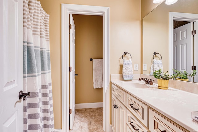 bathroom with vanity and tile patterned flooring
