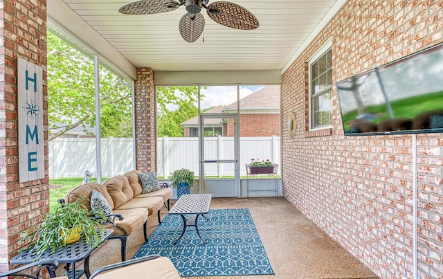 sunroom / solarium featuring an outdoor hangout area and ceiling fan
