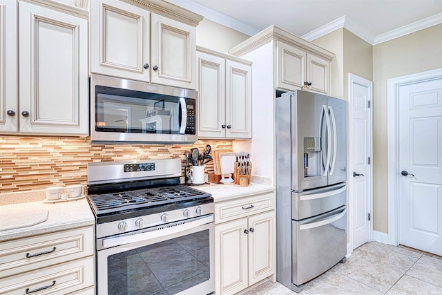 kitchen with light tile patterned floors, stainless steel appliances, tasteful backsplash, and crown molding