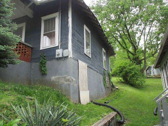 view of home's exterior featuring a lawn