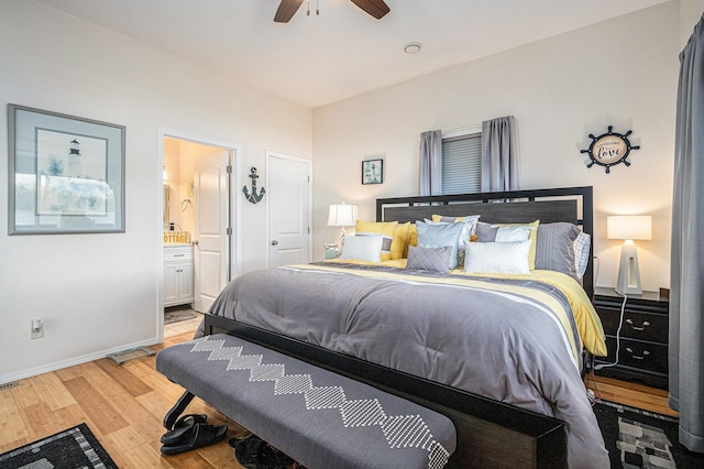 bedroom with baseboards, ceiling fan, connected bathroom, and light wood-type flooring