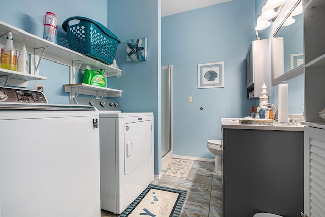 laundry room with washing machine and clothes dryer and laundry area
