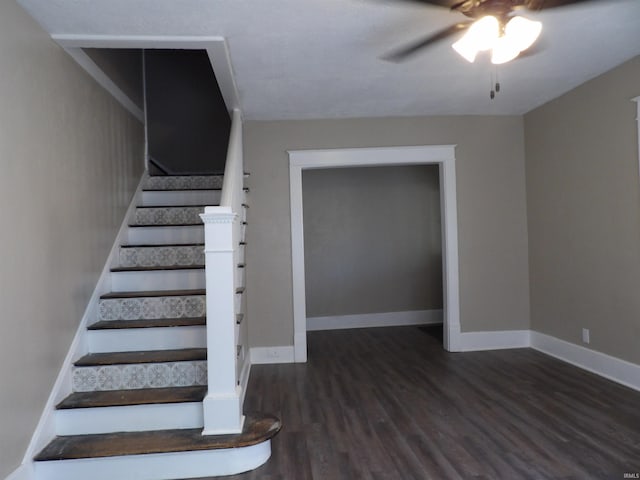 staircase with baseboards, a ceiling fan, and wood finished floors
