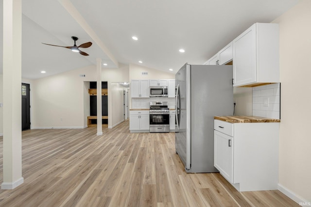 kitchen featuring white cabinetry, light wood finished floors, backsplash, and appliances with stainless steel finishes