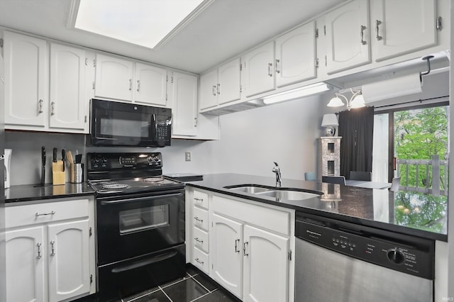 9404 S Lake Ridge Dr, Bloomington, IN 47401 - kitchen featuring white cabinets, dark countertops, black appliances, and a sink
