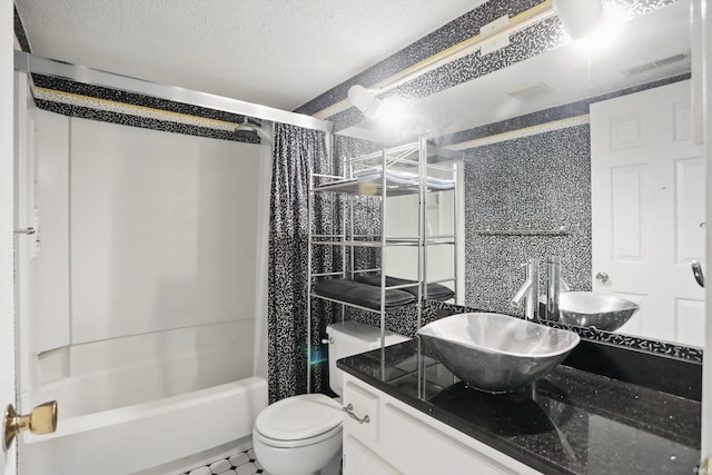 9404 S Lake Ridge Dr, Bloomington, IN 47401 - full bathroom featuring toilet, vanity, shower / bath combination with curtain, and a textured ceiling