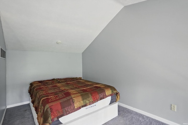9404 S Lake Ridge Dr, Bloomington, IN 47401 - carpeted bedroom with vaulted ceiling and baseboards
