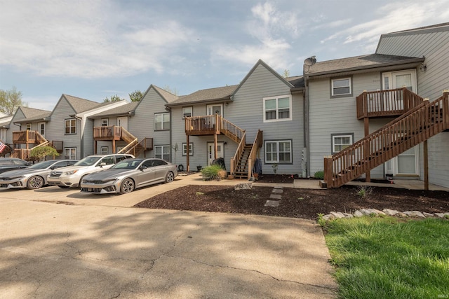 view of front of home featuring a residential view and stairs