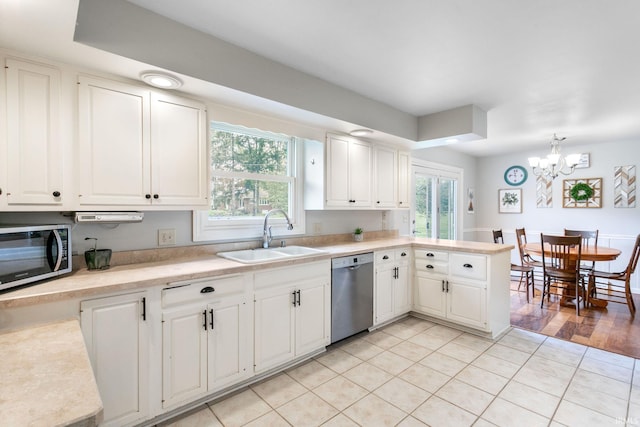kitchen featuring a sink, light countertops, and appliances with stainless steel finishes