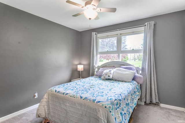 bedroom with carpet floors, baseboards, and a ceiling fan