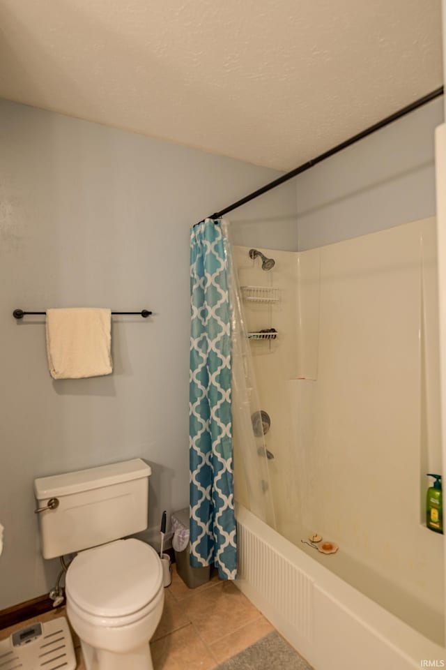 full bathroom with tile patterned flooring, toilet, and shower / bath combo
