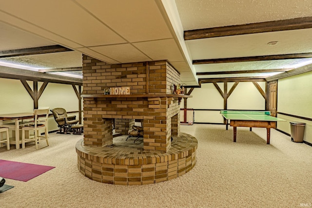 recreation room with carpet flooring and a fireplace