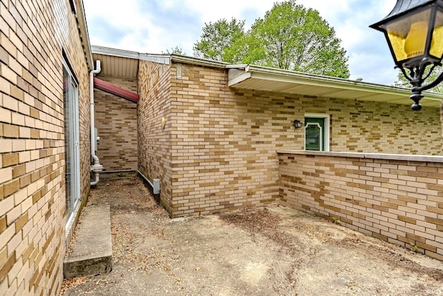 view of home's exterior with brick siding