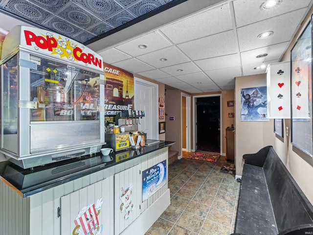 bar with a paneled ceiling and recessed lighting