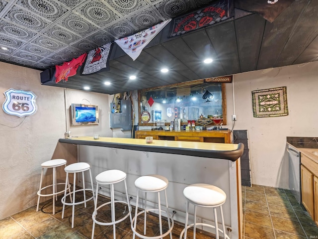 bar with indoor wet bar and dishwasher