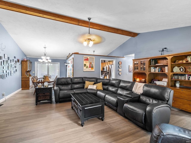 living room featuring lofted ceiling with beams, a notable chandelier, light wood-type flooring, and baseboards