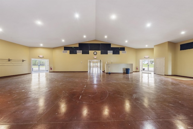11499 W Nobles Chapel Rd, Elberfeld, IN 47613 - unfurnished living room featuring a wealth of natural light, concrete flooring, high vaulted ceiling, and visible vents