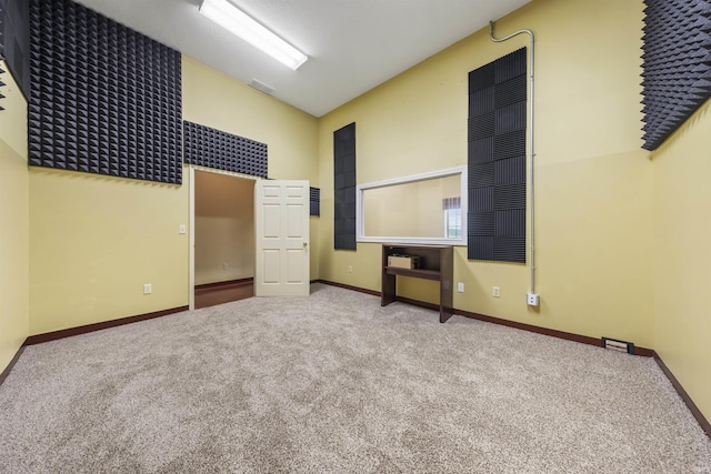 11499 W Nobles Chapel Rd, Elberfeld, IN 47613 - carpeted empty room with baseboards and high vaulted ceiling