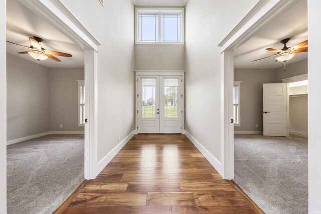 11499 W Nobles Chapel Rd, Elberfeld, IN 47613 - carpeted foyer entrance with baseboards, ceiling fan, and a towering ceiling