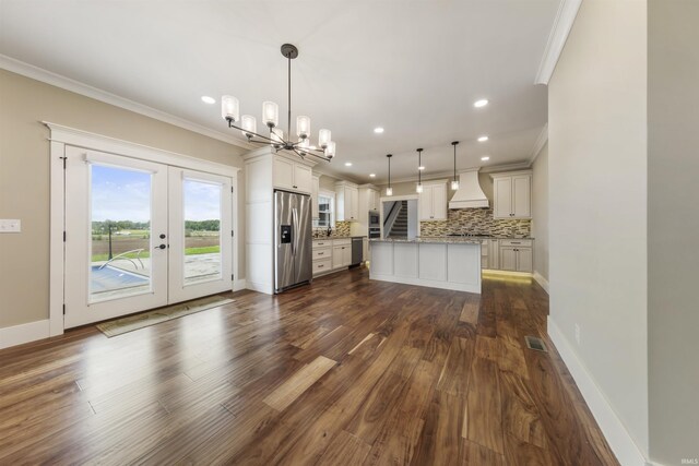 11499 W Nobles Chapel Rd, Elberfeld, IN 47613 - kitchen featuring ornamental molding, decorative backsplash, a notable chandelier, custom range hood, and appliances with stainless steel finishes