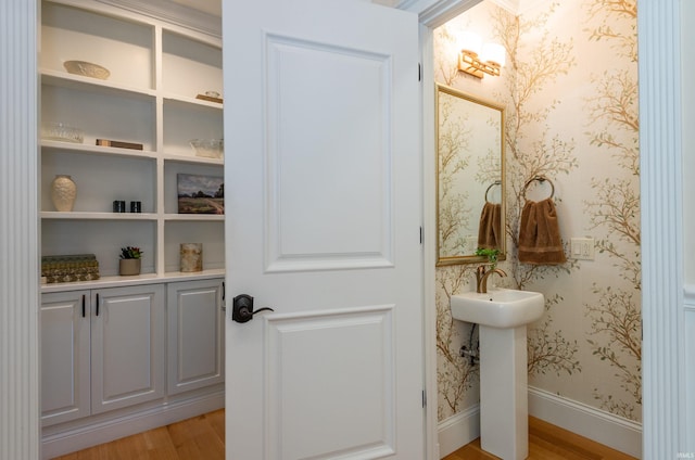 9225 S Foggy Ridge Ln, Bloomington, IN 47401 - bathroom featuring baseboards, wallpapered walls, and wood finished floors