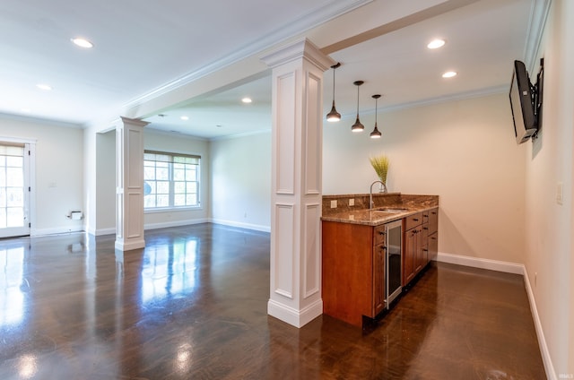 9225 S Foggy Ridge Ln, Bloomington, IN 47401 - bar with baseboards, a sink, crown molding, and ornate columns