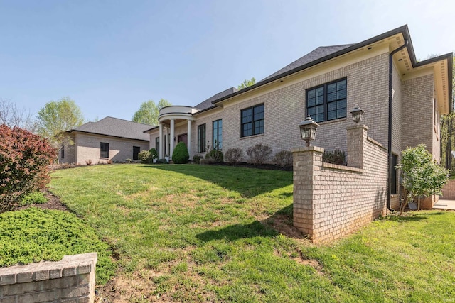 9225 S Foggy Ridge Ln, Bloomington, IN 47401 - view of front of property with a front yard and brick siding