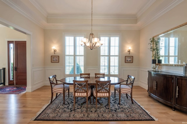 9225 S Foggy Ridge Ln, Bloomington, IN 47401 - dining space featuring light wood finished floors, a decorative wall, and wainscoting