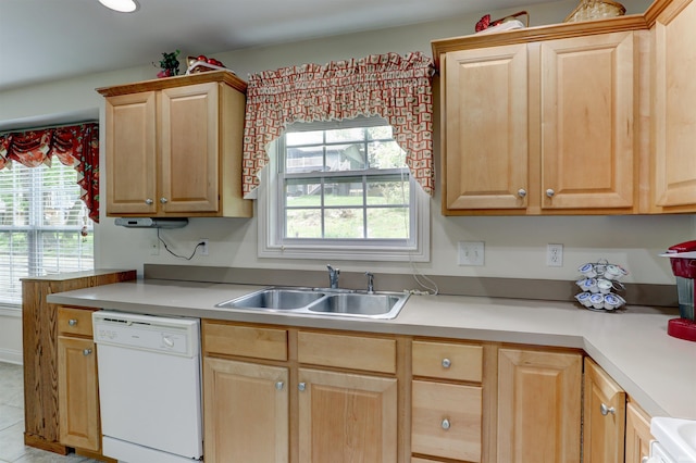 918 S December 25th Ln, Santa Claus, IN 47579 - kitchen with light countertops, light brown cabinetry, a sink, and dishwasher