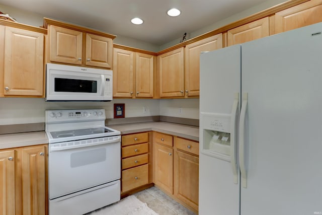 918 S December 25th Ln, Santa Claus, IN 47579 - kitchen with light brown cabinetry, white appliances, light countertops, light tile patterned flooring, and recessed lighting