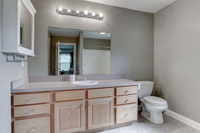 918 S December 25th Ln, Santa Claus, IN 47579 - full bathroom featuring vanity, toilet, baseboards, and tile patterned floors