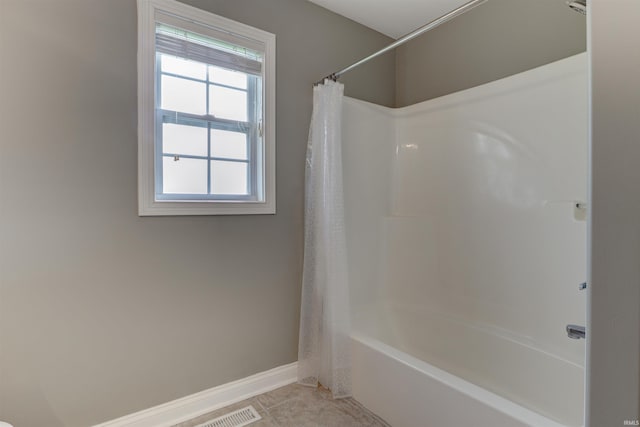 918 S December 25th Ln, Santa Claus, IN 47579 - bathroom featuring tile patterned flooring, baseboards, and shower / bathtub combination with curtain