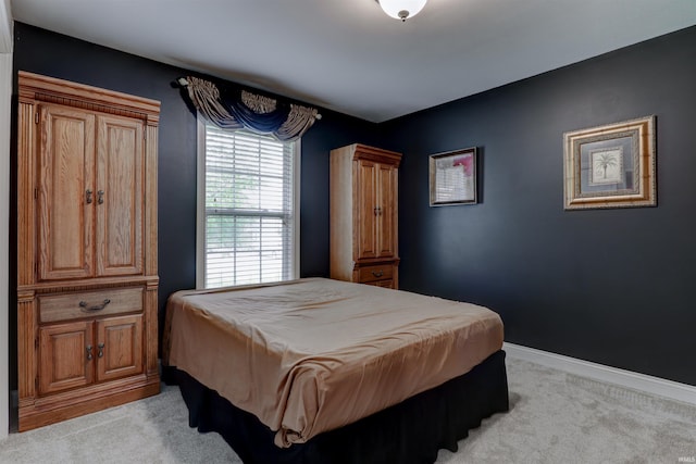 918 S December 25th Ln, Santa Claus, IN 47579 - bedroom featuring light colored carpet and baseboards