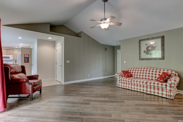 918 S December 25th Ln, Santa Claus, IN 47579 - living area with a ceiling fan, vaulted ceiling, baseboards, and wood finished floors