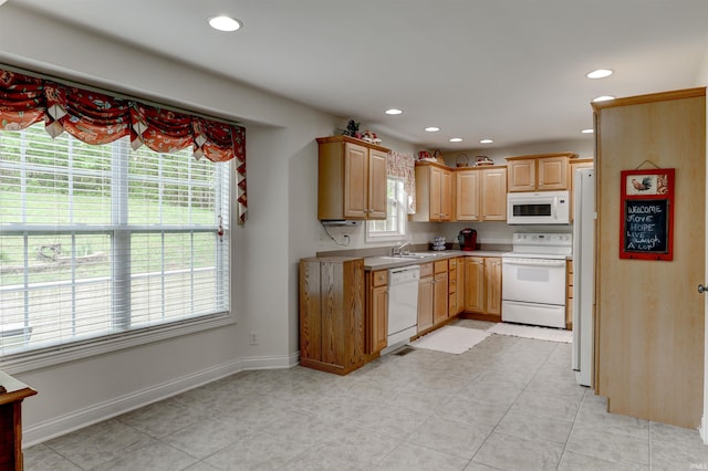 918 S December 25th Ln, Santa Claus, IN 47579 - kitchen with recessed lighting, light countertops, and white appliances