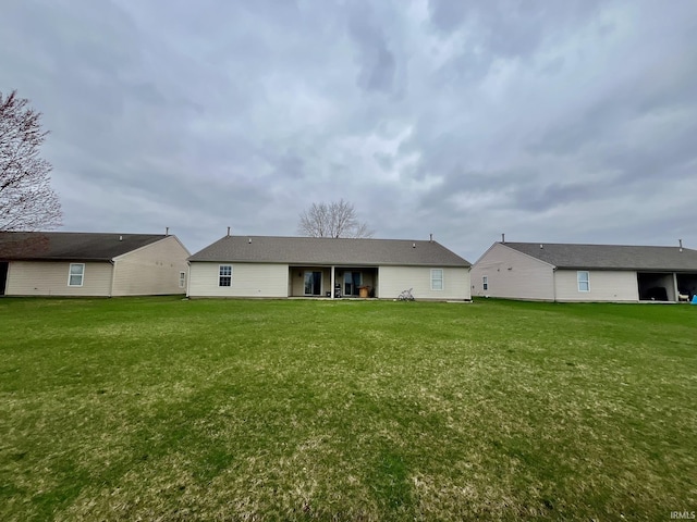 back of property with a yard