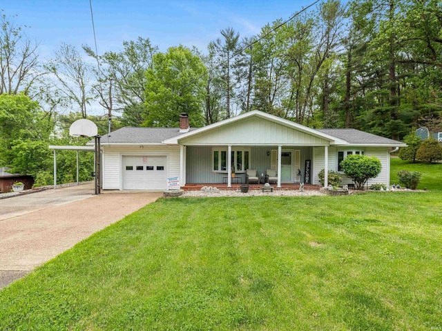 single story home with an attached garage, covered porch, a chimney, a front yard, and driveway