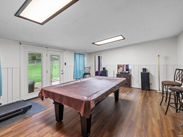 game room with pool table, a decorative wall, and wood finished floors