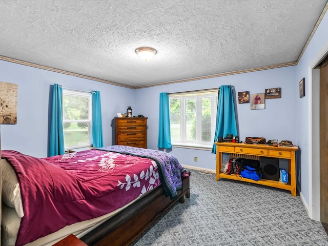 carpeted bedroom featuring crown molding, a textured ceiling, baseboards, and multiple windows