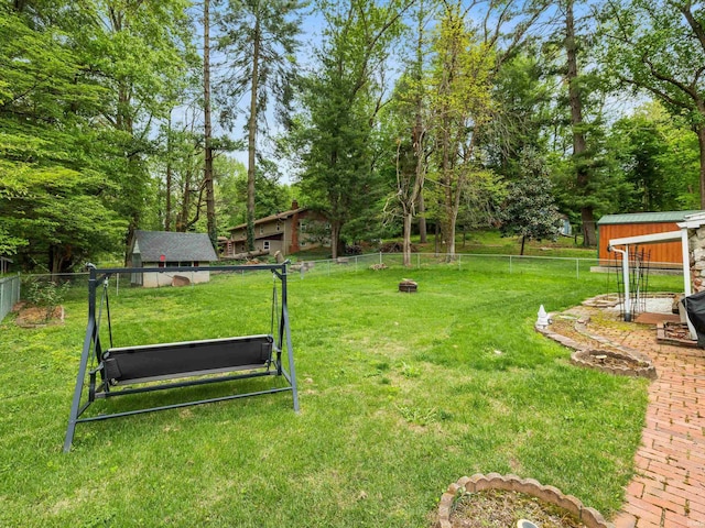 view of yard featuring an outbuilding and a fenced backyard