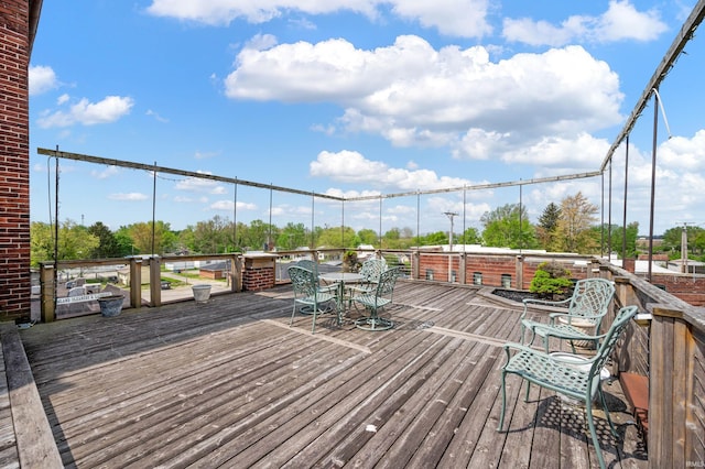 deck with outdoor dining area